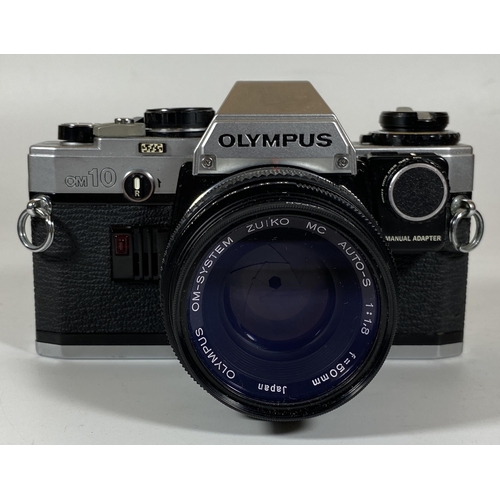 137 - A VINTAGE OLYMPUS OM10 CAMERA FITTED WITH ZUIKO MC AUTO 50MM LENS