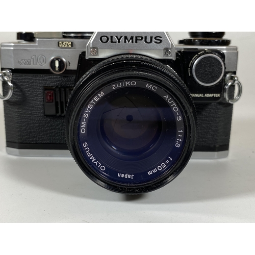 137 - A VINTAGE OLYMPUS OM10 CAMERA FITTED WITH ZUIKO MC AUTO 50MM LENS