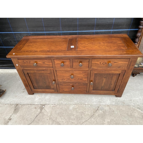 2849A - A MODERN OAK SIDEBOARD ENCLOSING SIX DRAWERS AND TWO CUPBOARDS, 59