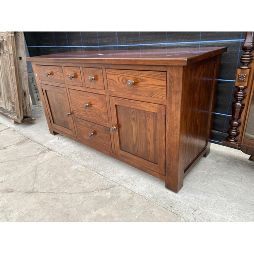 2849A - A MODERN OAK SIDEBOARD ENCLOSING SIX DRAWERS AND TWO CUPBOARDS, 59