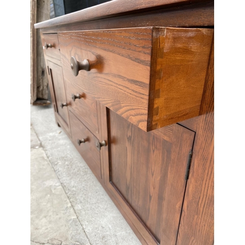 2849A - A MODERN OAK SIDEBOARD ENCLOSING SIX DRAWERS AND TWO CUPBOARDS, 59