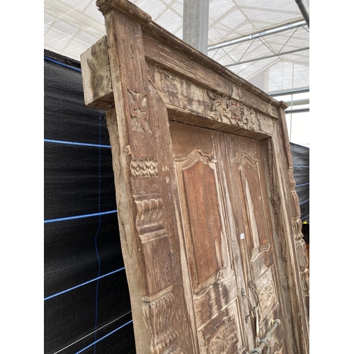 2850 - A PAIR OF INDIAN HARDWOOD PANELLED DOORS, 83 X 56