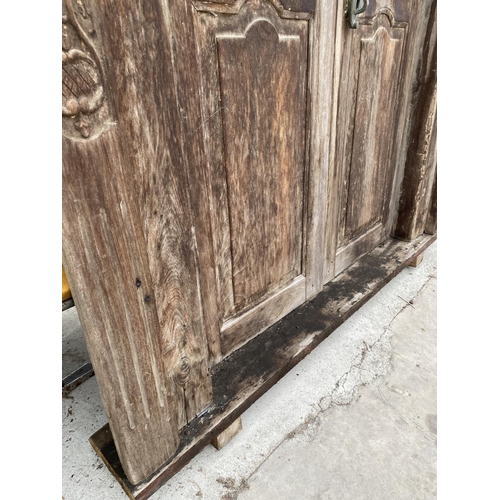 2850 - A PAIR OF INDIAN HARDWOOD PANELLED DOORS, 83 X 56