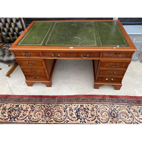 2854 - A MODERN YEW WOOD TWIN PEDESTAL DESK WITH INSET LEATHER TOP ENCLOSING EIGHT DRAWERS, 60