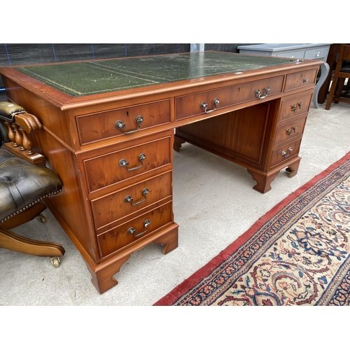 2854 - A MODERN YEW WOOD TWIN PEDESTAL DESK WITH INSET LEATHER TOP ENCLOSING EIGHT DRAWERS, 60