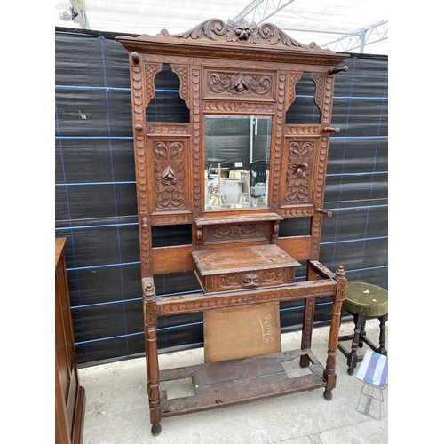 2863 - A VICTORIAN CARVED OAK MIRRORED HALL STAND