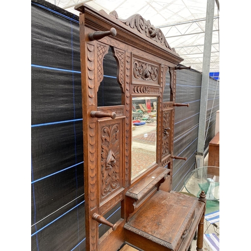 2863 - A VICTORIAN CARVED OAK MIRRORED HALL STAND