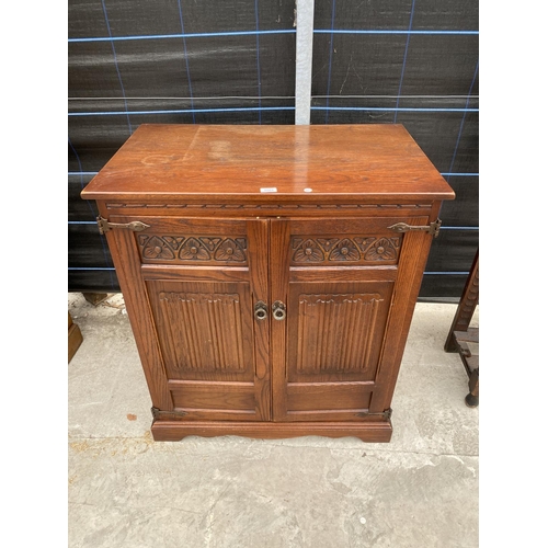 2864 - AN OAK 'OLD CHARM' TV CABINET, 34.5