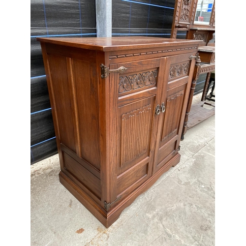 2864 - AN OAK 'OLD CHARM' TV CABINET, 34.5