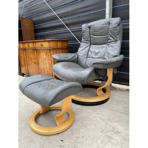 2867 - A MODERN SWIVEL BASE RECLINER CHAIR WITH STOOL