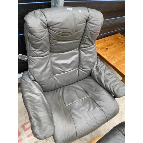 2867 - A MODERN SWIVEL BASE RECLINER CHAIR WITH STOOL