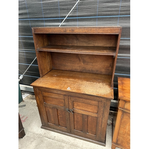 2869 - AN EARLY 20 TH CENTURY OAK TWO DOOR CUPBOARD WITH OPEN TOP SECTION, 37.5