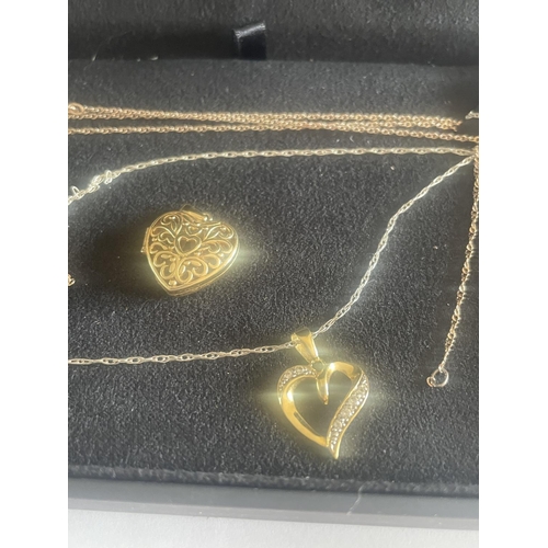 521 - TWO SILVER GILT NECKLACES WITH HEART PENDANTS IN A PRESENTATION BOX