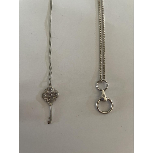 533 - FOUR SILVER NECKLACES WITH PENDANTS