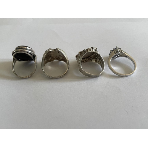 540 - FOUR VARIOUS SILVER RINGS