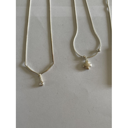 554 - FOUR SILVER NECKLACES WITH PENDANTS