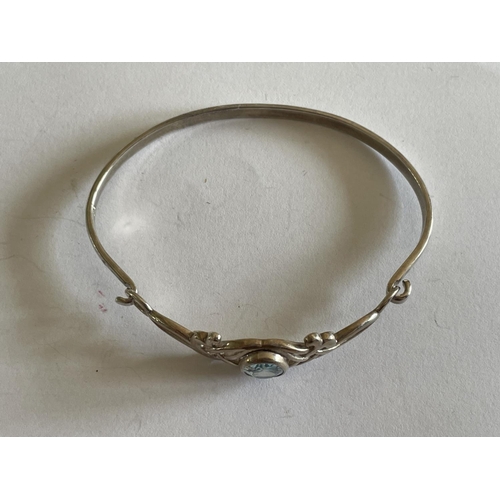 566 - A SILVER BANGLE