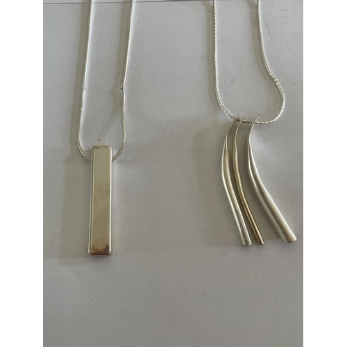 584 - FOUR SILVER NECKLACES WITH PENDANTS