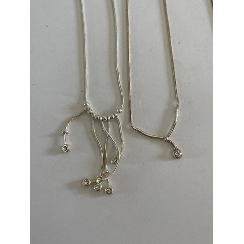 585 - FOUR SILVER NECKLACES WITH PENDANTS