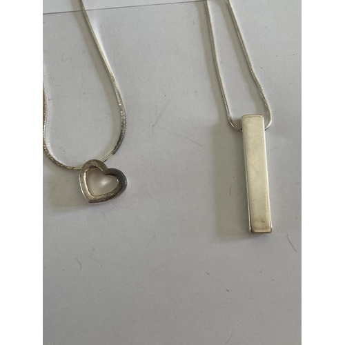 585 - FOUR SILVER NECKLACES WITH PENDANTS