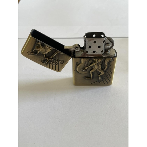 597 - A DECORATIVE ZIPPO STLE LIGHTER