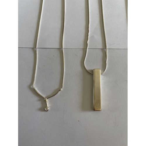 600 - FOUR SILVER NECKLACES WITH PENDANTS