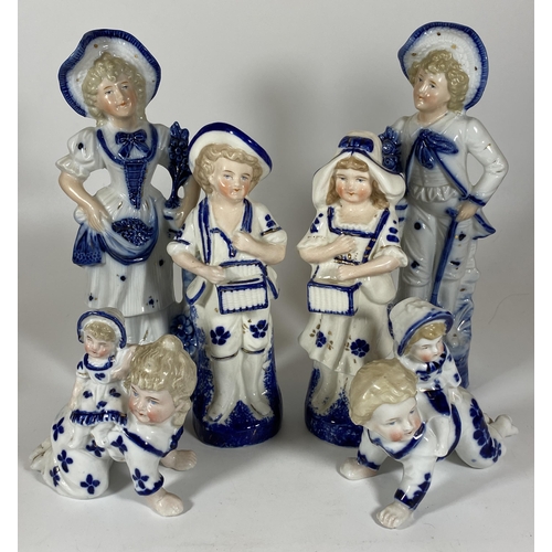 101 - A GROUP OF SIX CONTINENTAL BLUE AND WHITE PORCELAIN FIGURES, LARGEST HEIGHT 23CM