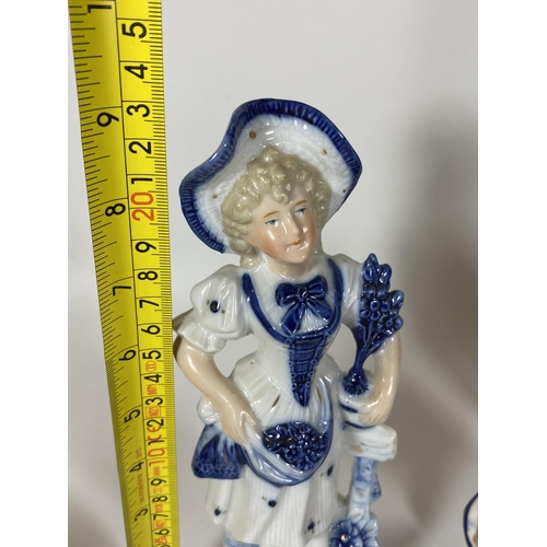 101 - A GROUP OF SIX CONTINENTAL BLUE AND WHITE PORCELAIN FIGURES, LARGEST HEIGHT 23CM