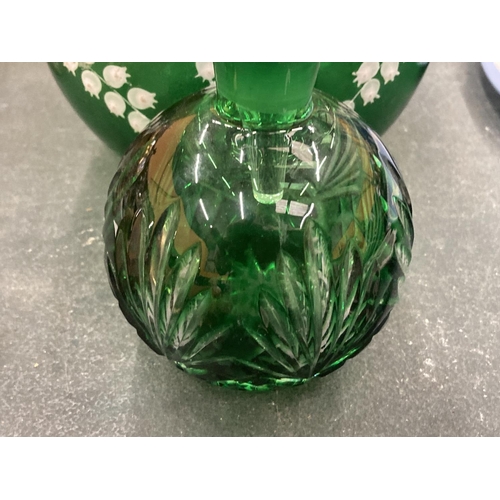 145 - A VICTORIAN GREEN GLASS JUG WITH STOPPER WITH HAND PAINTED DECORATION PLUS A SCENT BOTTLE WITH STOPP... 