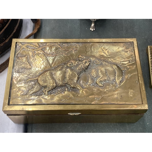 151 - A VINTAGE BRASS BOX WITH AN EMBOSSED IMAGE OF WILD BOARS TO THE LID