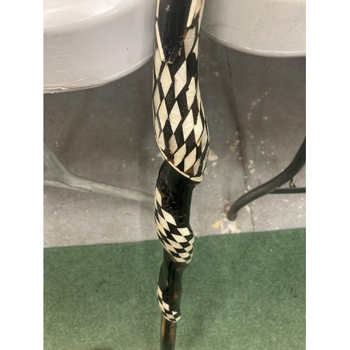 170 - A WOODEN TWISTED SNAKE WALKING STICK WITH INLAID MOTHER OF PEARL