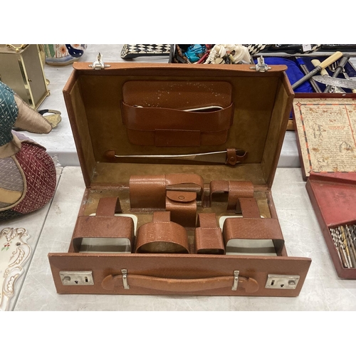 180 - A VINTAGE GENTS GROOMING KIT, CASED, A LADIES VANITY SET, CASED AND AN EMPTY GROOMING KIT CASE