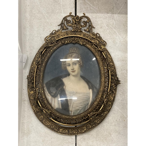 181 - AN EARLY 19TH CENTURY HAND PAINTED PORTRAIT OF A LADY, SIGNED M.STIELER, IN ORNATE BRASS OVAL FRAME ... 