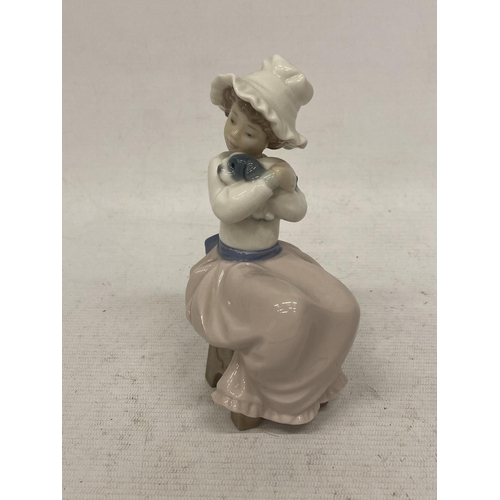 726 - A NAO FIGURINE OF A GIRL HUGGING HER DOG