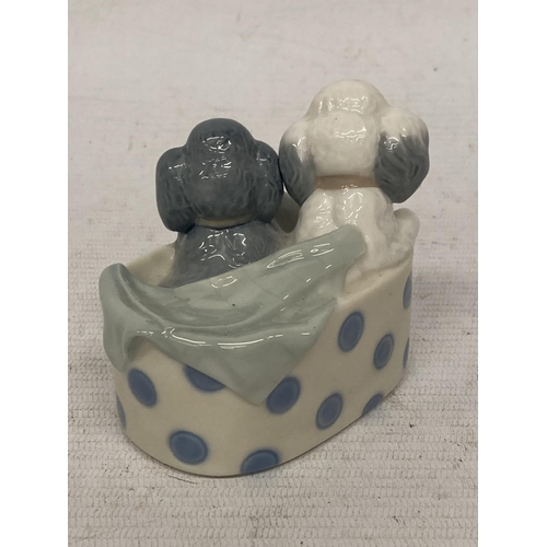 730 - A NAO FIGURE OF TWO DOGS IN A BASKET