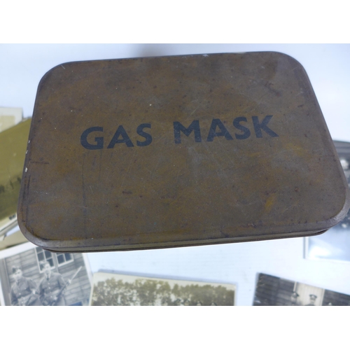 380 - A WORLD WAR II GAS MASK TIN CONTAINING APPROXIMATELY 35 WORLD WAR I AND WORLD WAR II PHOTOGRAPHS