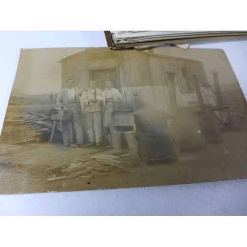 380 - A WORLD WAR II GAS MASK TIN CONTAINING APPROXIMATELY 35 WORLD WAR I AND WORLD WAR II PHOTOGRAPHS