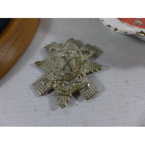 384 - A BLACK WATCH CAP BADGE, BLACK WATCH PLAGUE AND A ROYAL STAFFORD CHINA LORD ROBERTS DISH (3)