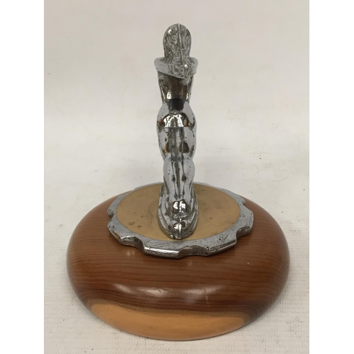 17 - A NUDE LADY CHROME EFFECT CAR MASCOT ON WOODEN BASE