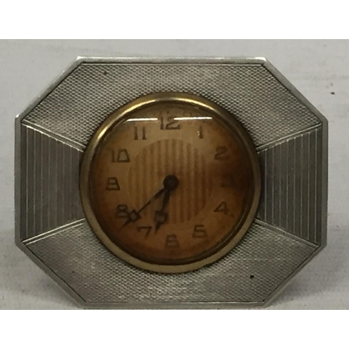 21 - AN ART DECO HALLMARKED SILVER CLOCK WITH ENGINE TURNED DESIGN