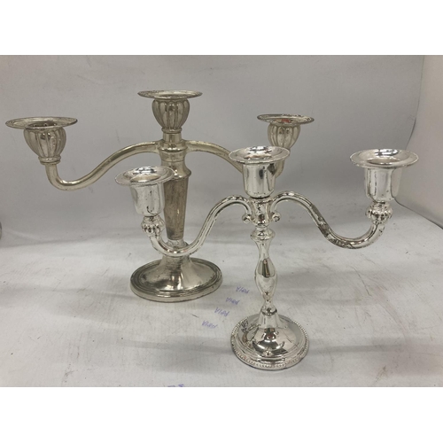 196 - A QUANTITY OF SILVER PLATED ITEMS TO INCLUDE CANDLEABRAS, PHOTO FRAMES, A TOAST RACK SMALL TEAPOTS, ... 