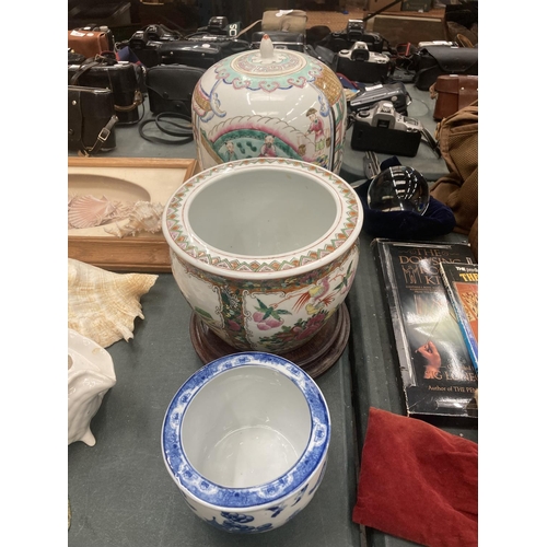 205 - A LARGE ORIENTAL JAR WITH LID, A LARGE PLANTER WITH WOODEN STAND AND A SMALLER BLUE AND WHITE PLANTE... 