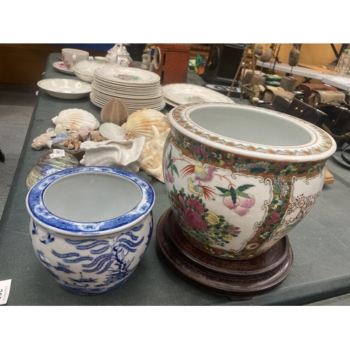 205 - A LARGE ORIENTAL JAR WITH LID, A LARGE PLANTER WITH WOODEN STAND AND A SMALLER BLUE AND WHITE PLANTE... 