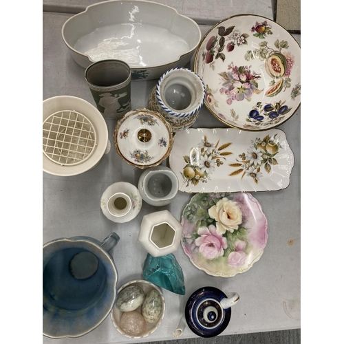 217 - A QUANTITY OF CERAMIC AND CHINA TO INCLUDE BOWLS, VASES, EGGS, A PLANTER, ETC PLUS A PIECE OF SIGNED... 