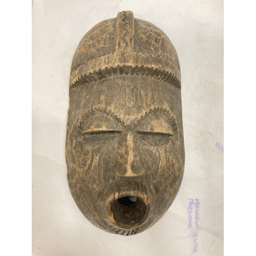 234 - AN AFRICAN WOODEN WALL HANGING PLUS AN AFRICAN MASK