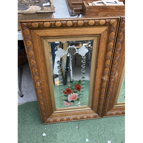 58 - A PAIR OF OAK FRAMED MIRRORS WITH PAINTED FLORAL AND ETCHED DESIGN