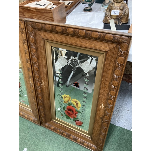 58 - A PAIR OF OAK FRAMED MIRRORS WITH PAINTED FLORAL AND ETCHED DESIGN