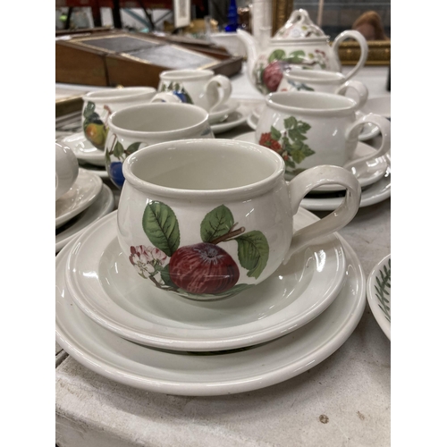 915 - A PORTMEIRION POTTERY TEASET WITH FURTHER SERVING DISHES