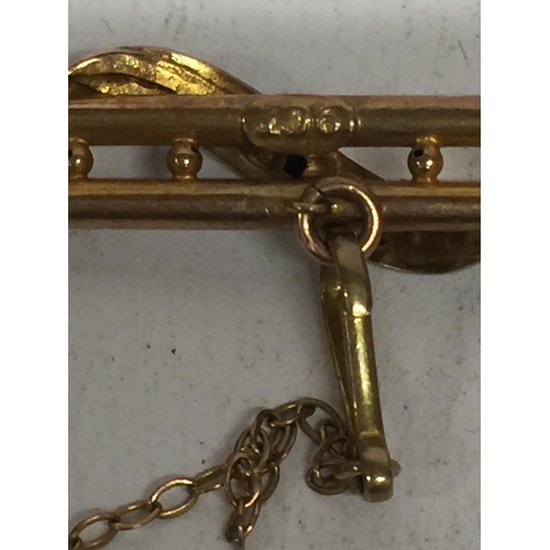 503 - A 9CT LADDER SHAPED BAR BROOCH