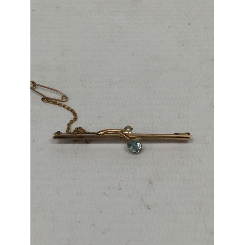 509 - A BLUE STONE 9CT GOLD PIN